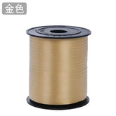 Curling Ribbon Roll(0.5CM*200M/Gold) on a spool, perfect for decorating gifts and crafts.